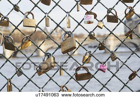 Padlocks on chain link fence View Large Photo Image Stock Image - Padlocks on chain link fence. Fotosearch