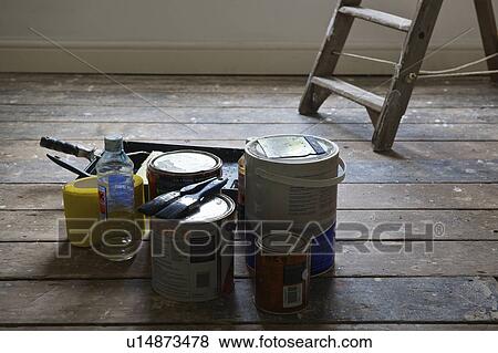 Paint cans and brushes in empty house View Large Photo Image Stock Photo - Paint cans and brushes in empty house. Fotosearch