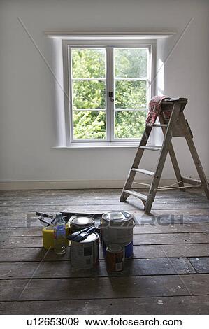 Paint cans and ladder in empty house View Large Photo Image Stock Photo - Paint cans and ladder in empty house. Fotosearch