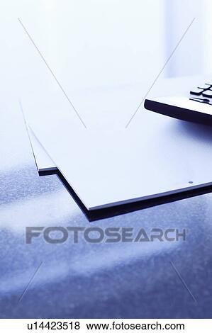 Papers and calculator on office desk View Large Photo Image Stock Photo - Papers and calculator on office desk. Fotosearch
