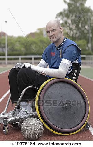 Picture - Para rugby player in wheelchair on track. Fotosearch
