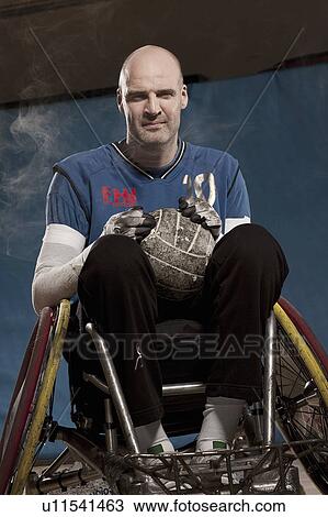Stock Image - Para rugby player in wheelchair. Fotosearch