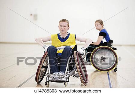 Stock Image - Para rugby players in wheelchairs. Fotosearch