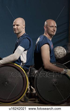 Stock Image - Para rugby players in wheelchairs. Fotosearch