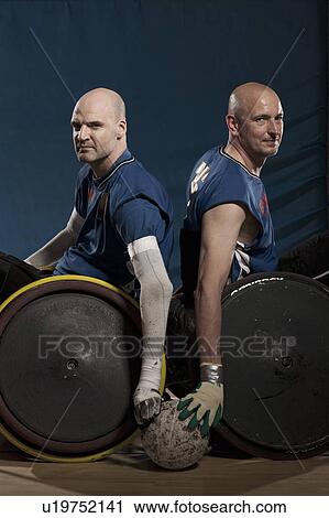 Stock Image - Para rugby players in wheelchairs. Fotosearch