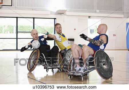 Para rugby players playing rugby View Large Photo Image Stock Image - Para rugby players playing rugby. Fotosearch