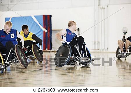 Para rugby players playing rugby View Large Photo Image Stock Image - Para rugby players playing rugby. Fotosearch