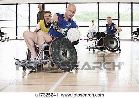 Stock Image - Para rugby players playing rugby. Fotosearch