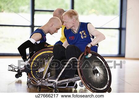 Stock Photo - Para rugby players playing rugby. Fotosearch