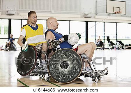 Stock Photograph - Para rugby players playing rugby. Fotosearch