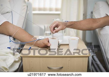 Patients having coffee in hospital beds View Large Photo Image Stock Photo - Patients having coffee in hospital beds. Fotosearch