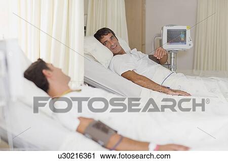 Patients talking in hospital beds View Large Photo Image Stock Image - Patients talking in hospital beds. Fotosearch