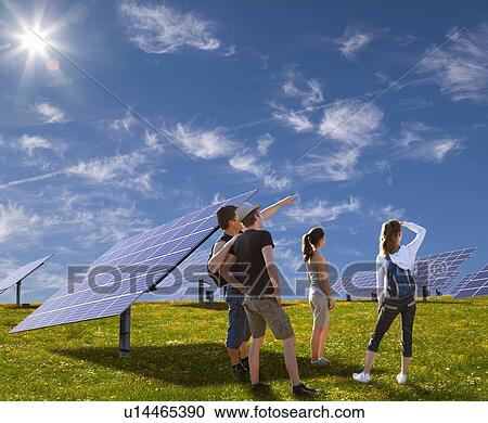 People standing in field by solar panels View Large Photo Image Stock Image - People standing in field by solar panels. Fotosearch