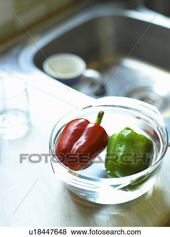Stock Photo - Peppers in bowl on sink. Fotosearch