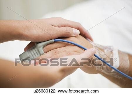 Person holding hospital patient’s hand View Large Photo Image Stock Image - Person holding hospital patient’s hand. Fotosearch
