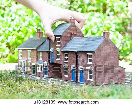 Person selecting model house View Large Photo Image Stock Photo - Person selecting model house. Fotosearch