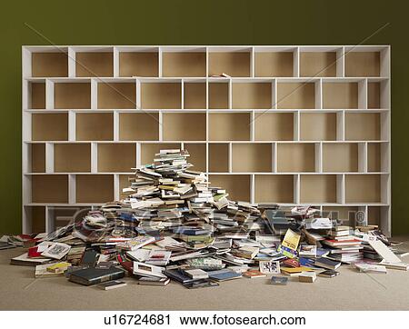 Pile of books by empty shelves View Large Photo Image Stock Image - Pile of books by empty shelves. Fotosearch