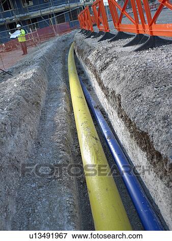 Stock Photo - Pipes underground at construction site. Fotosearch