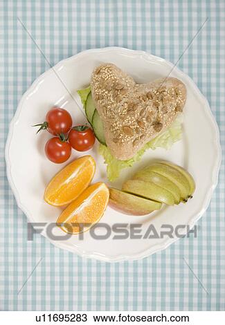 Plate of bread, fruit and vegetables View Large Photo Image Stock Image - Plate of bread, fruit and vegetables. Fotosearch