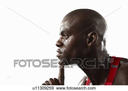Stock Photo - Profile of athlete touching his chin. Fotosearch