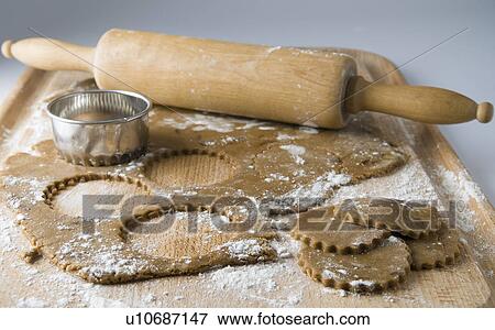 Raw cookies with dough and rolling pin View Large Photo Image Stock Photo - Raw cookies with dough and rolling pin. Fotosearch