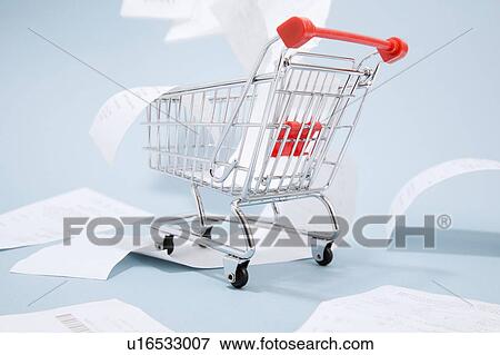 Stock Photo - Receipts spilling out of shopping cart. Fotosearch