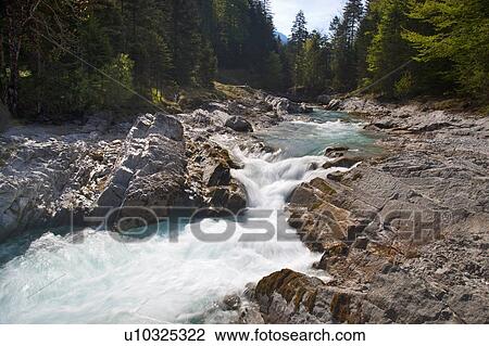 Stock Image - Rocky creek in forest. Fotosearch