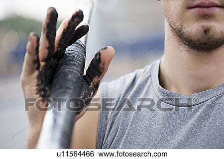 Runner carrying dirty pole View Large Photo Image Stock Photograph - Runner carrying dirty pole . Fotosearch