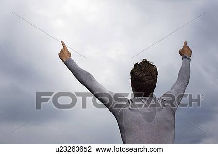 Stock Image - Runner cheering outdoors. Fotosearch