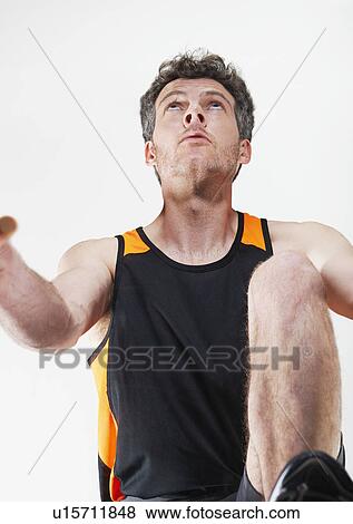 Stock Photo - Runner poised at starting line. Fotosearch