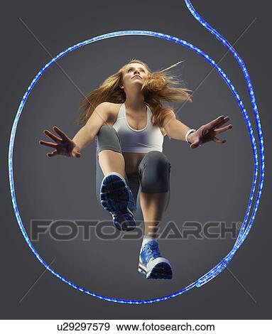 Stock Photo - Runner poised at starting line. Fotosearch