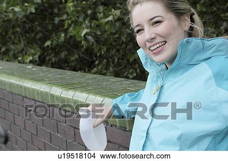 Runner resting on brick wall View Large Photo Image Picture - Runner resting on brick wall. Fotosearch