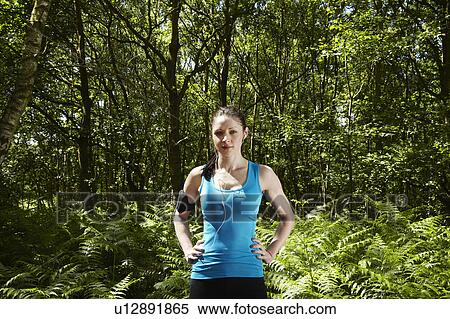 Runner standing in forest View Large Photo Image Stock Photography - Runner standing in forest. Fotosearch