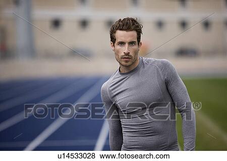 Stock Photo - Runner standing on track. Fotosearch