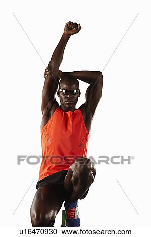 Runner stretching at starting line View Large Photo Image Stock Image - Runner stretching at starting line. Fotosearch