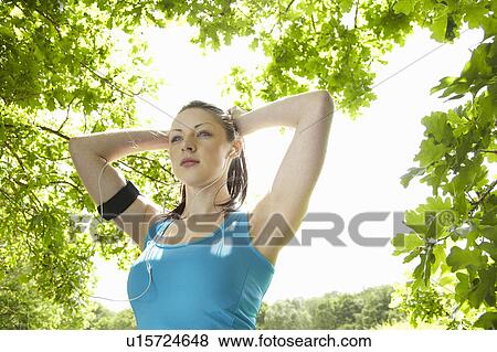 Runner stretching in forest View Large Photo Image Stock Photo - Runner stretching in forest. Fotosearch