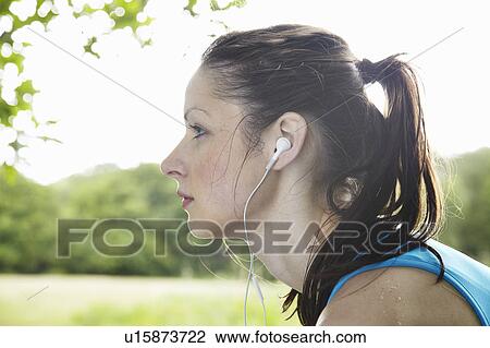 Runner wearing headphones View Large Photo Image Stock Image - Runner wearing headphones. Fotosearch