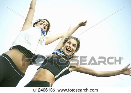 Runners celebrating with medals View Large Photo Image Stock Photography - Runners celebrating with medals. Fotosearch
