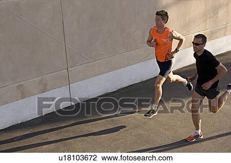 Runners jogging together View Large Photo Image Stock Image - Runners jogging together. Fotosearch