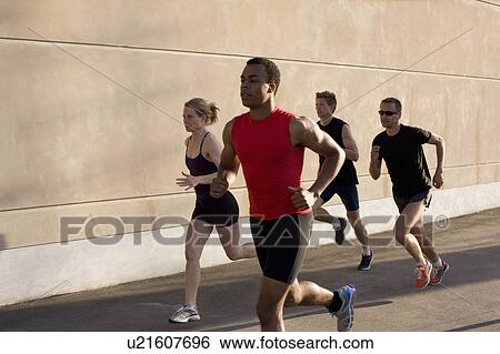 Runners jogging together View Large Photo Image Stock Photograph - Runners jogging together. Fotosearch