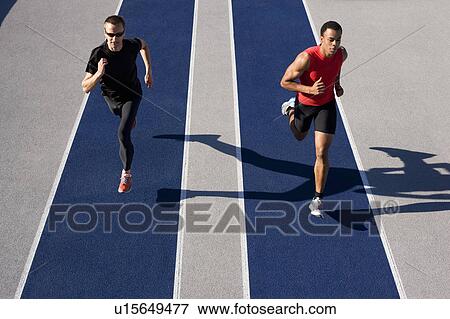 Runners racing on track View Large Photo Image Stock Photo - Runners racing on track. Fotosearch
