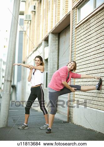 Runners stretching together View Large Photo Image Picture - Runners stretching together. Fotosearch