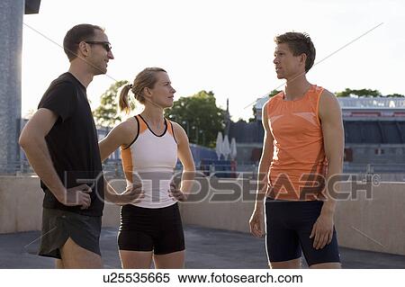Runners talking together View Large Photo Image Stock Photography - Runners talking together. Fotosearch