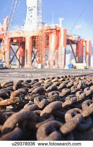 Rusted chains on oil rig View Large Photo Image Stock Photograph - Rusted chains on oil rig. Fotosearch