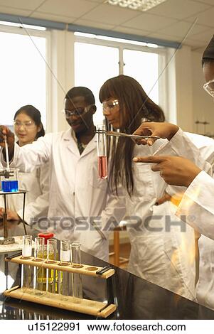 Scientist examining test tube in lab View Large Photo Image Stock Image - Scientist examining test tube in lab. Fotosearch