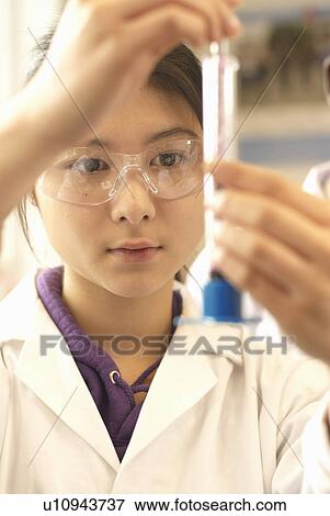Scientist examining test tube in lab View Large Photo Image Stock Photo - Scientist examining test tube in lab. Fotosearch