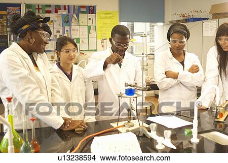 Picture - Scientists at work in lab. Fotosearch