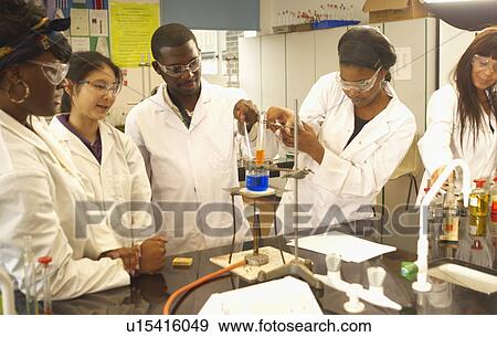 Scientists at work in lab View Large Photo Image Stock Photo - Scientists at work in lab. Fotosearch