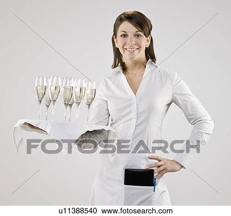 Server carrying tray of champagne flutes View Large Photo Image Stock Image - Server carrying tray of champagne flutes. Fotosearch