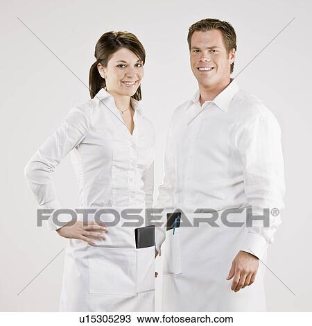 Servers wearing aprons with checks View Large Photo Image Stock Image - Servers wearing aprons with checks. Fotosearch